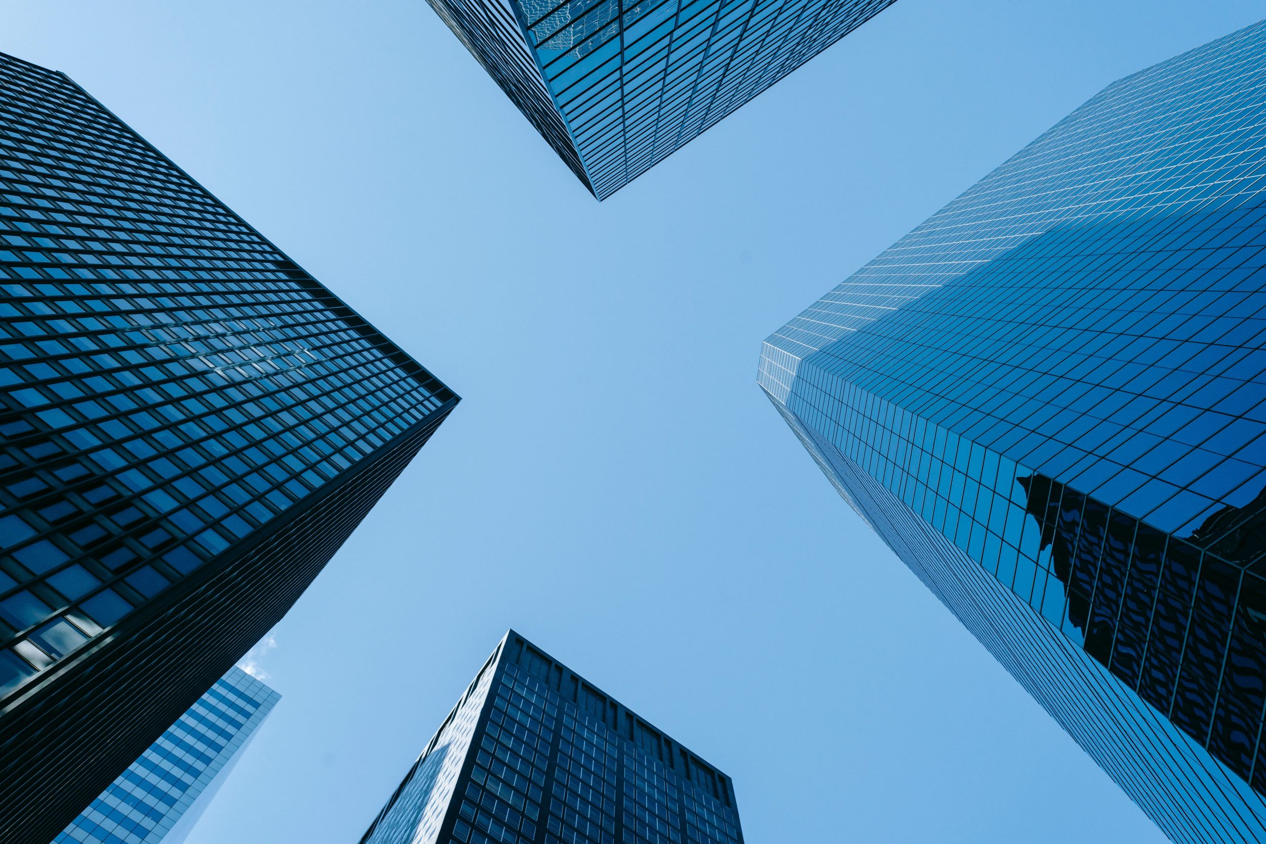 4 buildings looking up from the ground